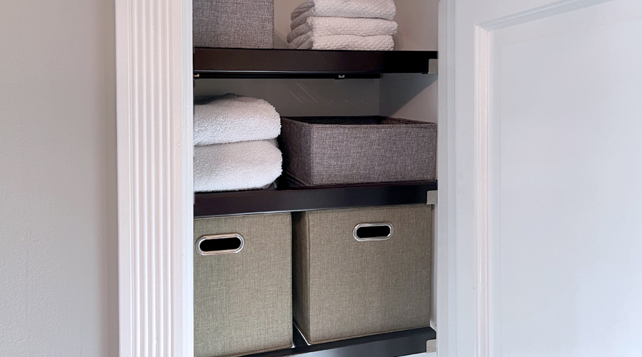 Using Storage bins in bathroom linen closet