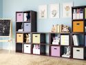 Multiple red mahogany 4 cube organizers used to create a complete storage solution for kids toys, books and crafts in a colorful kids playroom
