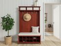 A red mahogany shoe bench hall tree with coats on hooks and tidy shoes, in a chic hallway creating a functional space for organizing outerwear and footwear.