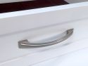 A close up of a white John Louis solid wood drawer with a modern handle  perfect for easy access to stored items.