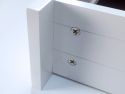 A close up of a white John Louis solid wood drawer side highlighting the easy DIY assembly
