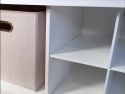 Closeup of entryway bench shoe cubby and cream storage bin cubby