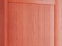 Closeup detail of the fluted wood panels of the red mahogany hall tree back