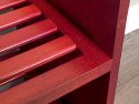 A close up featuring the ventilated shelf of a solid wood stackable shoe and shelving rack