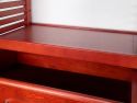 Closet showcasing a John Louis Home solid top wooden adjustable shelf positioned above a drawer in a neatly organized ventilated wooden shelf tower.