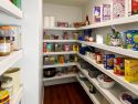 A neaty organized walk in pantry highlighting how renew wire shelf covers update and refresh shelving to a contemporary and stylish space.