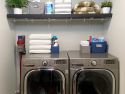 laundry room towels and cleaning items on wire shelving holding converted to a designer space using renew wire shelf covers