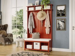 A cozy entryway with a wooden hall tree bench featuring storage bins, clothes and hats hanging from storage hooks providing a warm and inviting atmosphere.