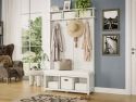 A cozy entryway with a white wooden hall tree bench featuring storage bins, clothes and hats hanging from storage hooks providing a warm and inviting atmosphere.