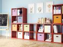 Multiple 4 cube organizers used to create a complete storage solution for kids toys, books and crafts in a colorful kids playroom