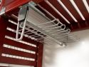 A closeup of how a John Louis Home under shelf mount belt and tie rack attached to the underside of a solid wooden shelf