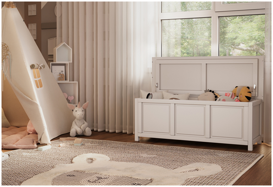 A white toy box with a hinged lid sits in a child's bedroom. The room has a teepee in the corner and toys scattered on the floor.