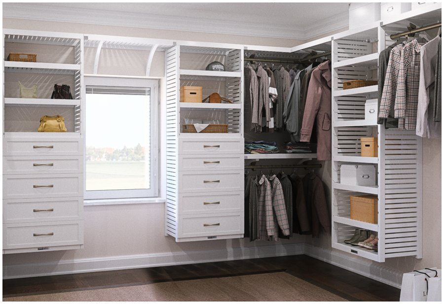 A well-organized walk-in closet with clothes hanging on racks and folded on shelves. There is a window at the back of the closet.